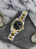Two-Tone Luxury Men's Watch – Black Dial, Gold & Silver Bracelet, Date Display